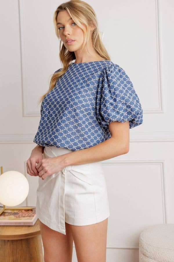 A textured blue woven top