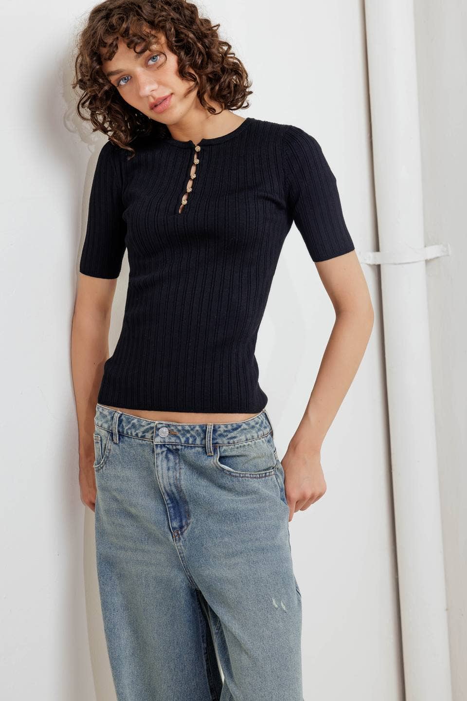 Black ribbed sweater knit top