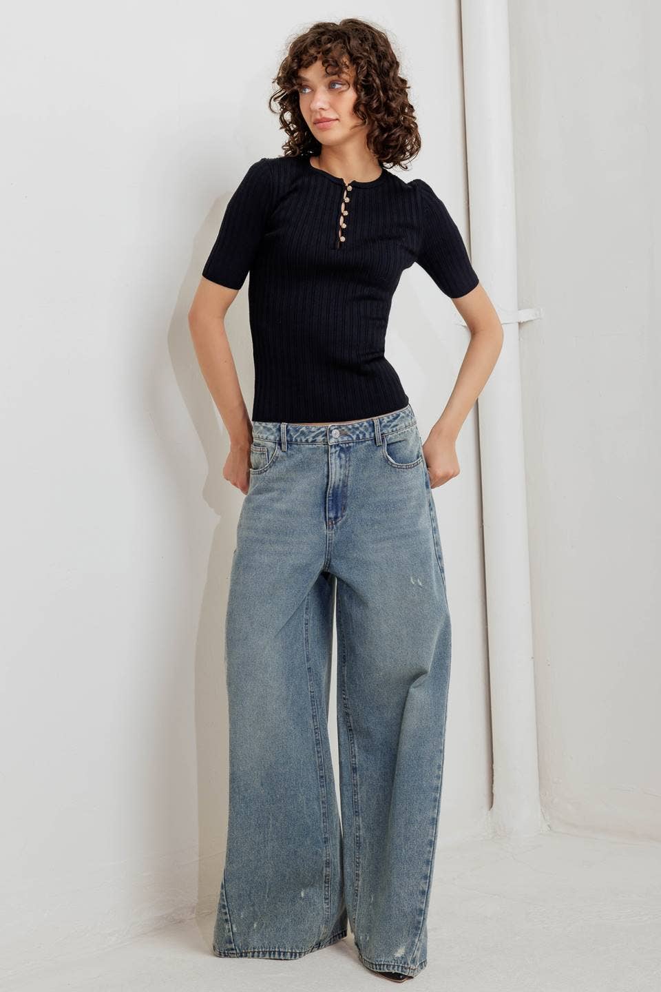 Black ribbed sweater knit top