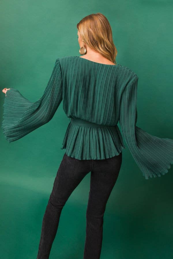 A mechanical pleated top with wrap around belt