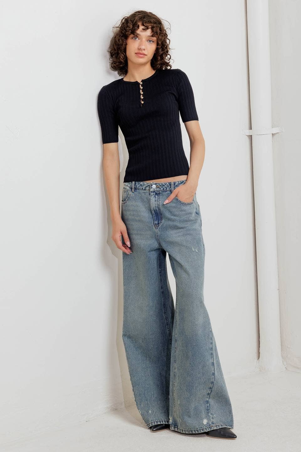 Black ribbed sweater knit top