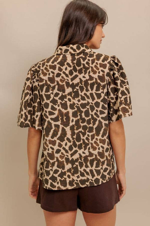 A cheetah woven top