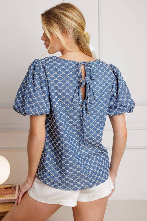 A textured blue woven top