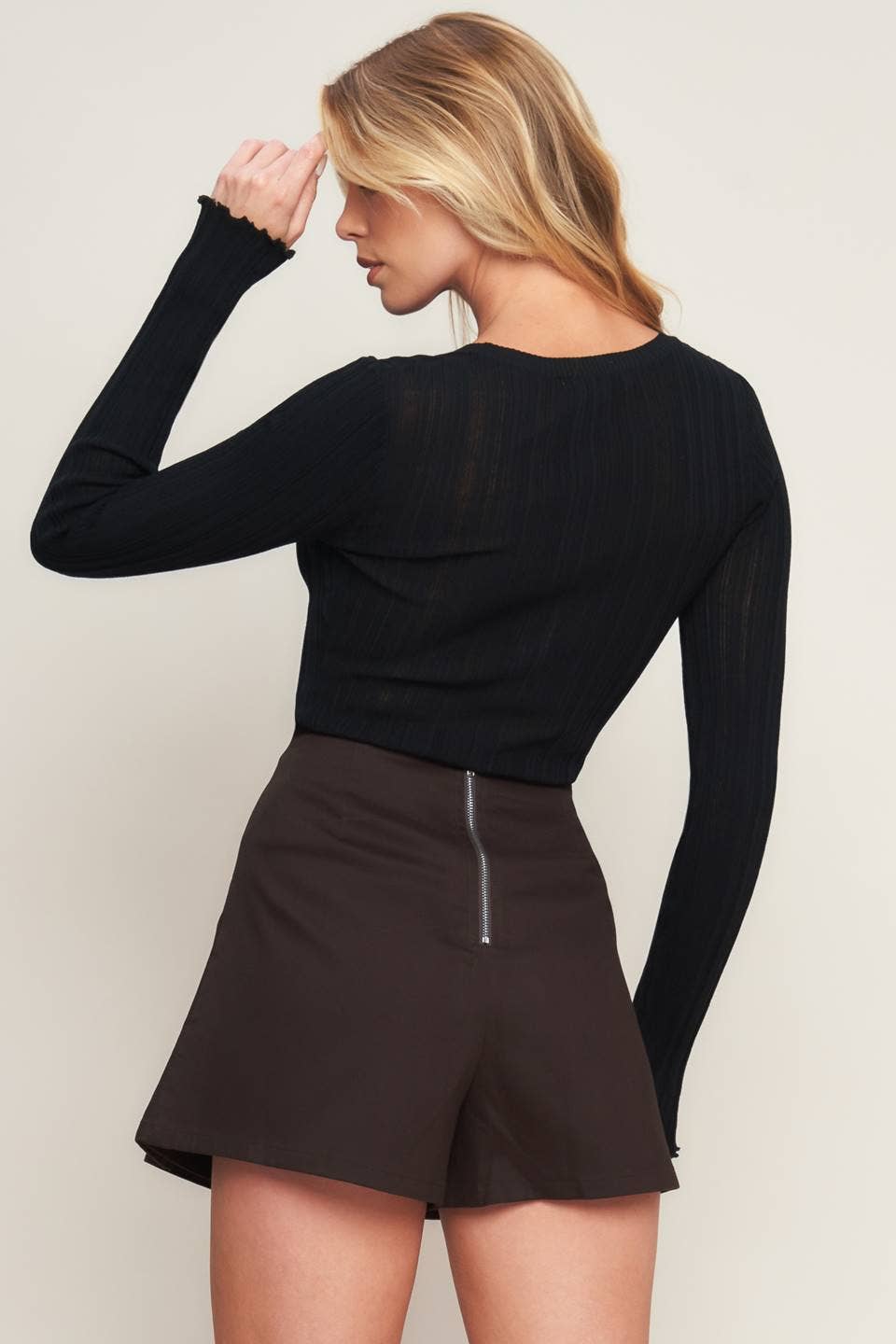 A solid woven brown skort